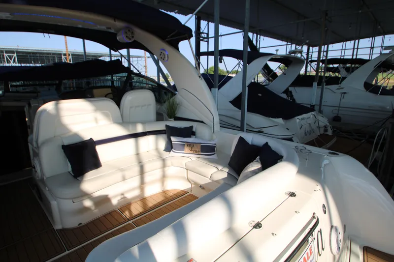 Slide: The Image of Interior of 2006 Sea Ray 400 Sundancer yacht with plush seating and helm controls. - 52