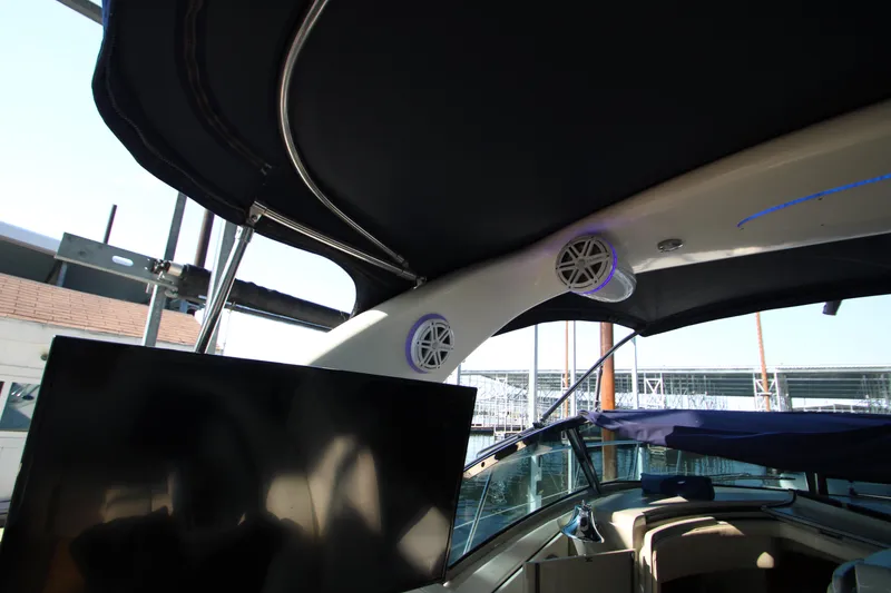 Slide: The Image of 2006 Sea Ray 400 Sundancer yacht with mounted outdoor TV on deck. - 56