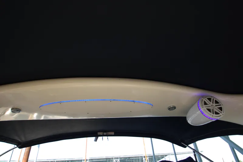 Slide: The Image of Luxurious 2006 Sea Ray 400 Sundancer boat interior with plush white seating and cushions. - 60