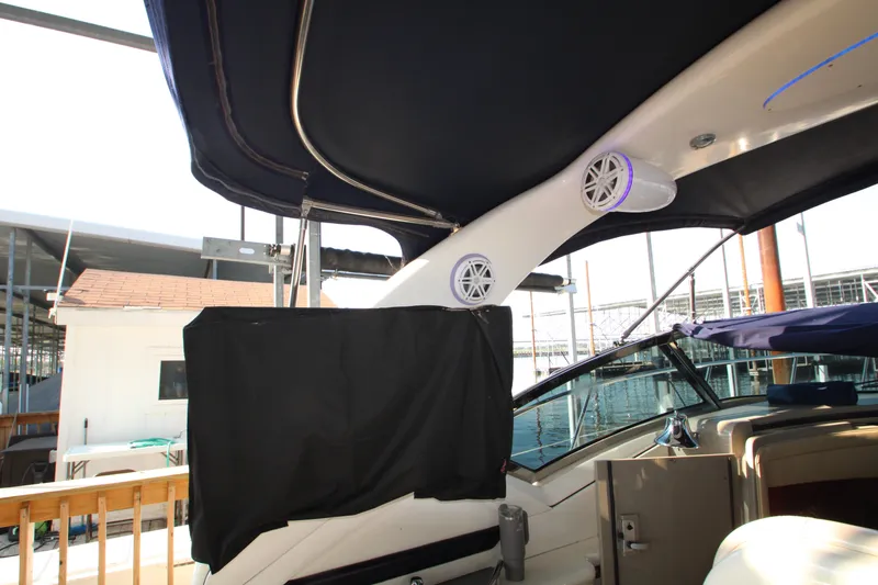 Slide: The Image of Interior view of 2006 Sea Ray 400 Sundancer boat with speakers and canopy. - 62