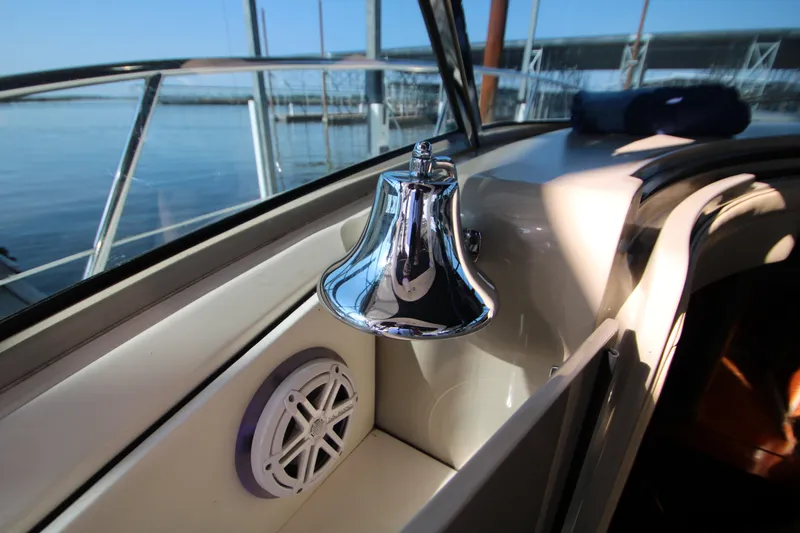 Slide: The Image of 2006 Sea Ray 400 Sundancer yacht interior with speakers and covered seating area. - 63