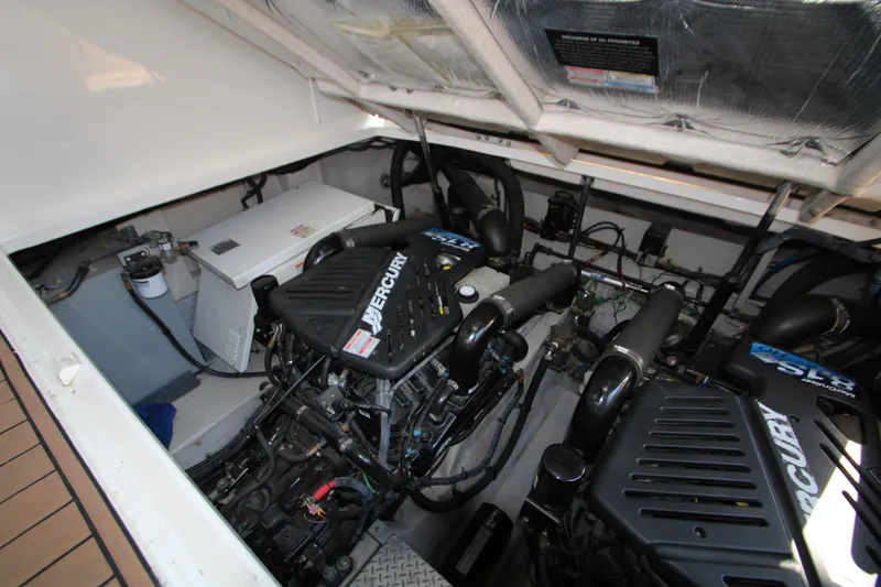 Slide: The Image of Engine compartment of a 2006 Sea Ray 400 Sundancer with visible components and wiring. - 69
