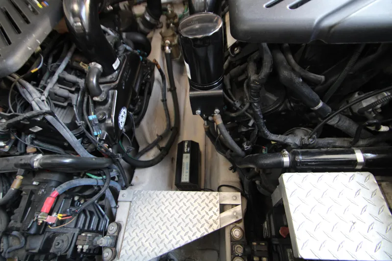Slide: The Image of Engine compartment of a 2006 Sea Ray 400 Sundancer with Mercury engine visible. - 71