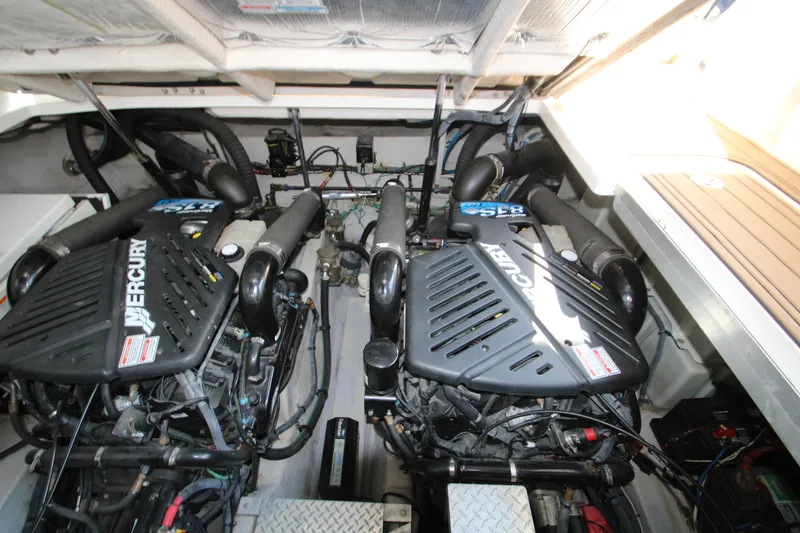 Slide: The Image of Engine compartment of a 2006 Sea Ray 400 Sundancer boat, showing mechanical components and wiring. - 72