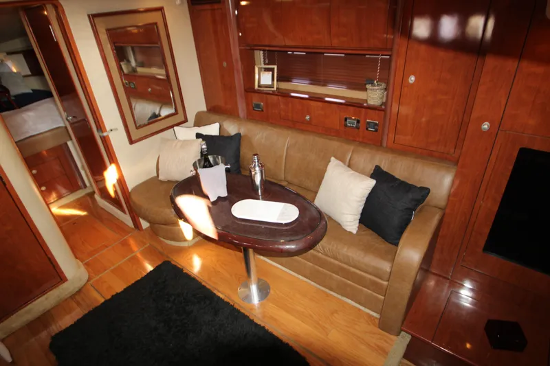 Slide: The Image of Luxurious 2006 Sea Ray 400 Sundancer yacht interior with modern kitchen and dining area. - 9