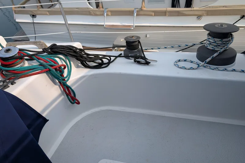 Slide: The Image of 1987 Cascade Center Cockpit sailboat deck with ropes and winches. - 14