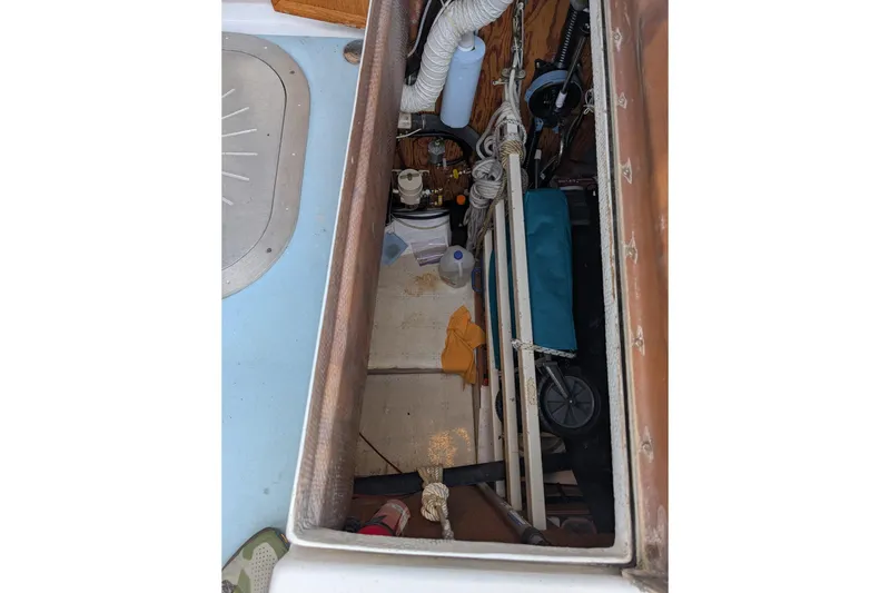 Slide: The Image of Interior storage compartment of a 1987 Cascade Center Cockpit sailboat. - 18