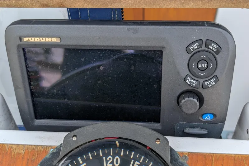 Slide: The Image of Furuno marine navigation device on 1987 Cascade Center Cockpit boat dashboard. - 20