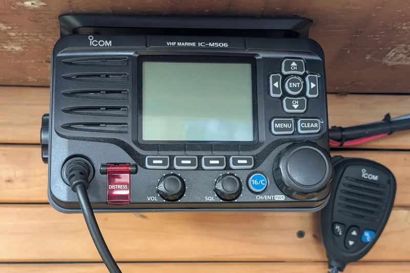 Slide: The Image of VHF marine radio IC-M506 on 1987 Cascade Center Cockpit boat, featuring distress button. - 26