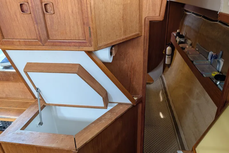 Slide: The Image of 1987 Cascade Center Cockpit interior with wooden cabinetry and storage compartments. - 41
