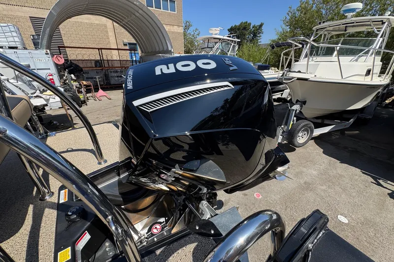 Slide: The Image of 2026 Barletta Cabrio 24UE pontoon boat interior with tan seating and canopy. - 16