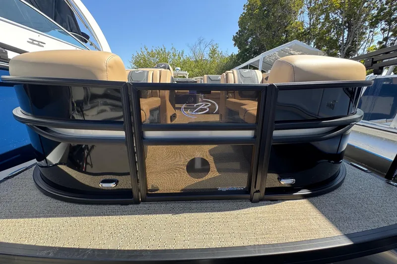 Slide: The Image of 2026 Barletta Cabrio 24UE pontoon boat with beige seating and sleek black exterior. - 17