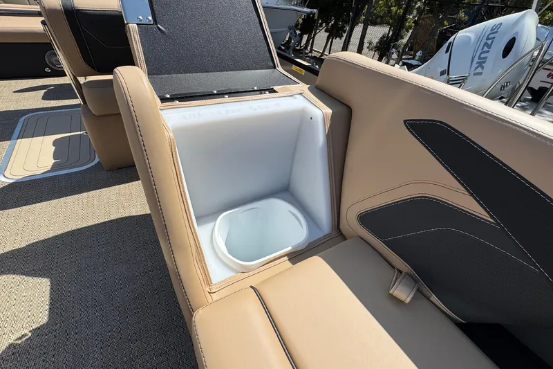 Slide: The Image of 2026 Barletta Cabrio 24UE pontoon boat on trailer under clear blue sky. - 21