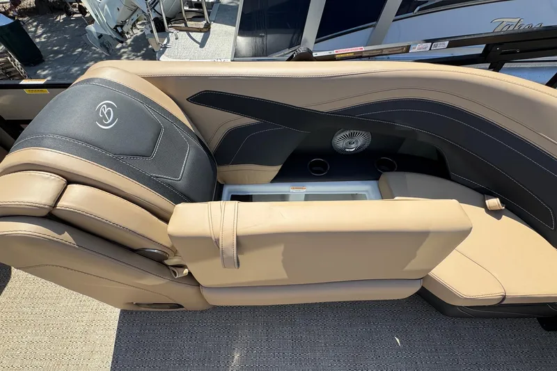 Slide: The Image of 2026 Barletta Cabrio 24UE pontoon boat on trailer, parked outdoors under clear blue sky. - 22