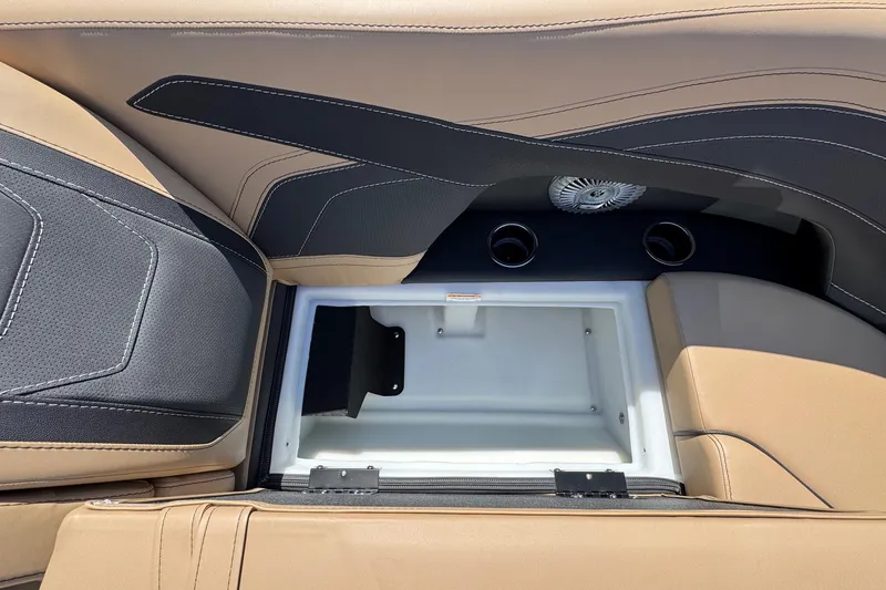 Slide: The Image of 2026 Barletta Cabrio 24UE pontoon boat on trailer, parked outdoors under clear blue sky. - 23