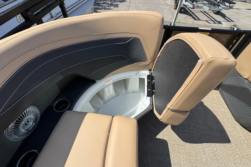 Slide: The Image of 2026 Barletta Cabrio 24UE pontoon boat on trailer, featuring Mercury outboard motor. - 24