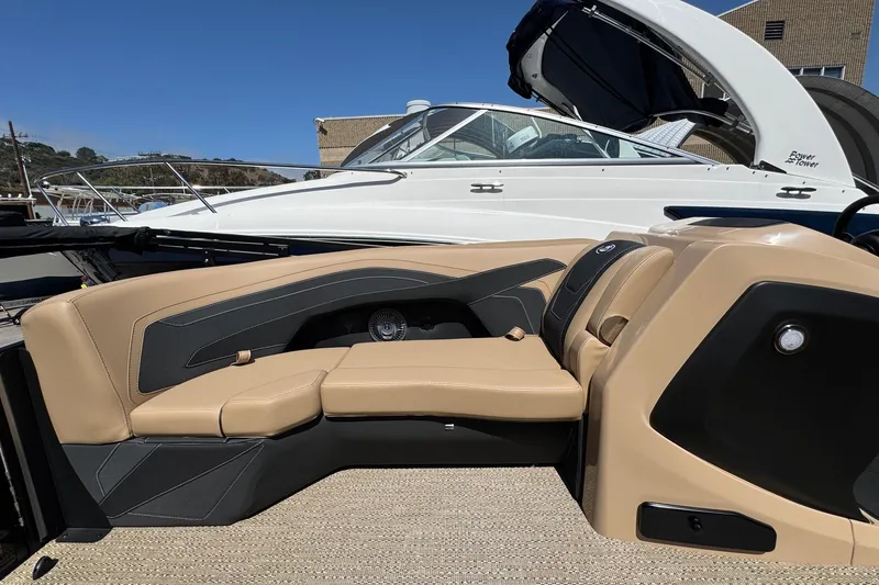 Slide: The Image of 2026 Barletta Cabrio 24UE pontoon boat with Mercury engine on trailer. - 25