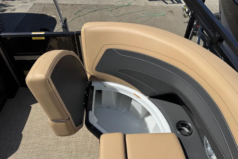 Slide: The Image of 2026 Barletta Cabrio 24UE pontoon boat with Mercury engine on trailer, outdoors. - 28