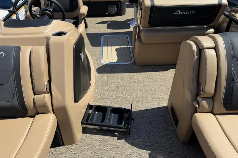 Slide: The Image of 2026 Barletta Cabrio 24UE pontoon boat on trailer, parked outdoors. - 30