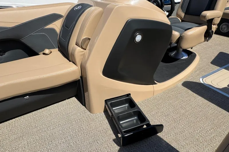 Slide: The Image of 2026 Barletta Cabrio 24UE pontoon boat on trailer, parked outdoors. - 31