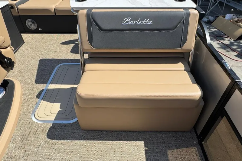 Slide: The Image of 2026 Barletta Cabrio 24UE pontoon boat on trailer, parked outdoors. - 32