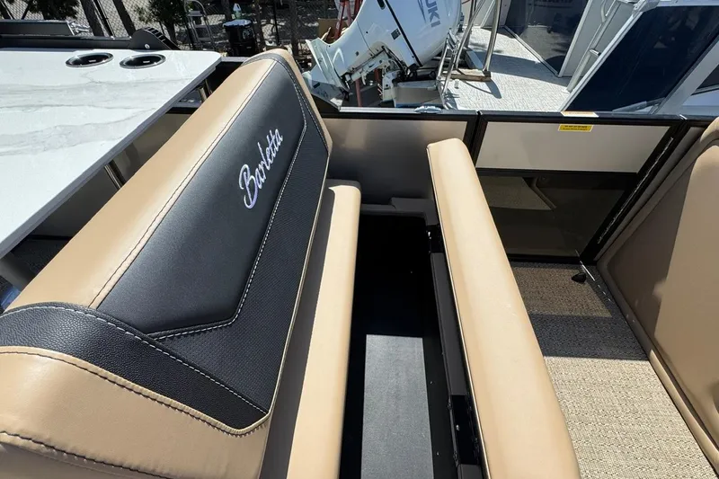 Slide: The Image of 2026 Barletta Cabrio 24UE pontoon boat on trailer under clear blue sky. - 35