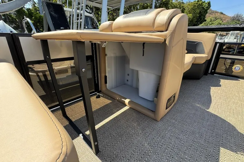 Slide: The Image of Luxurious seating on 2026 Barletta Cabrio 24UE pontoon boat, featuring tan and black upholstery. - 40