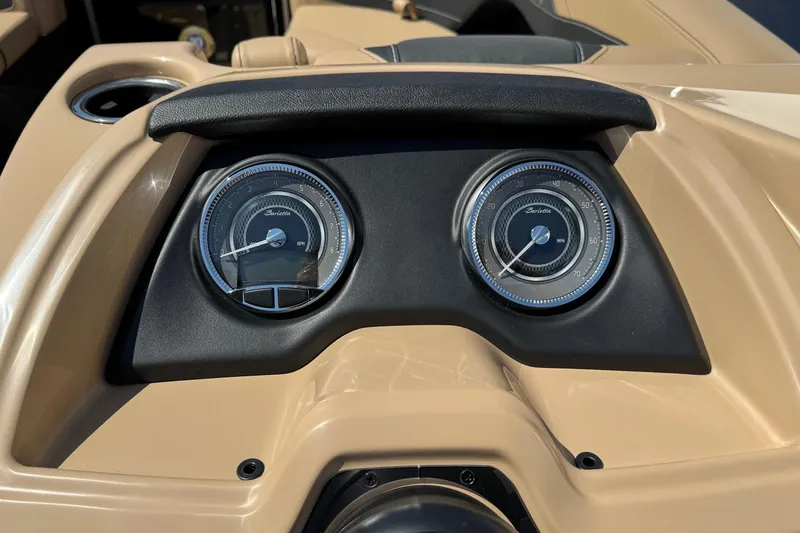 Slide: The Image of 2026 Barletta Cabrio 24UE boat interior with luxurious tan and black seating. - 44