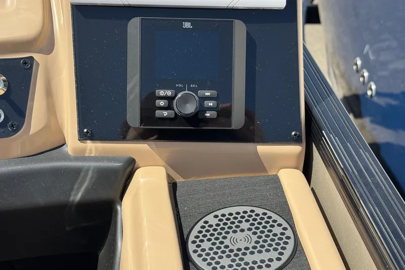 Slide: The Image of 2026 Barletta Cabrio 24UE pontoon boat interior with tan and black seating. - 49