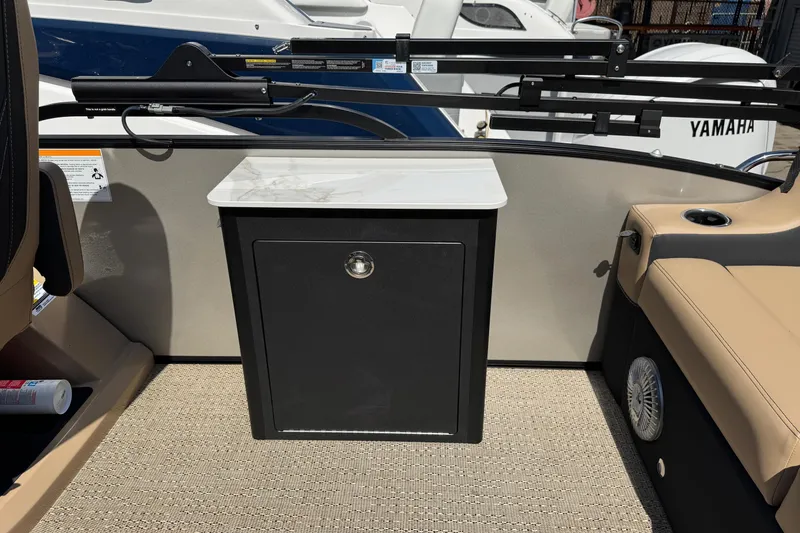 Slide: The Image of 2026 Barletta Cabrio 24UE boat interior with marble table and cup holders. - 54