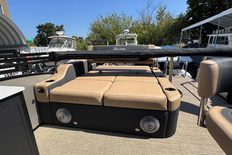 Slide: The Image of Luxurious seating and table on 2026 Barletta Cabrio 24UE pontoon boat. - 57