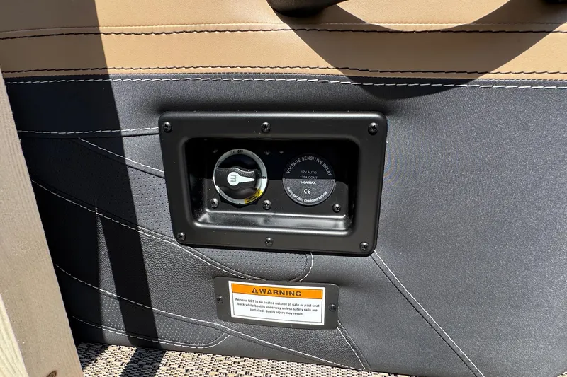 Slide: The Image of 2026 Barletta Cabrio 24UE boat interior with captain's chair and control panel. - 64