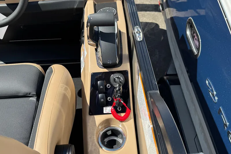 Slide: The Image of Interior view of 2026 Barletta Cabrio 24UE boat console with controls and seating. - 74