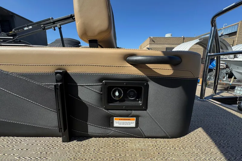 Slide: The Image of 2026 Barletta Cabrio 24UE boat interior detail with tan and black upholstery. - 86