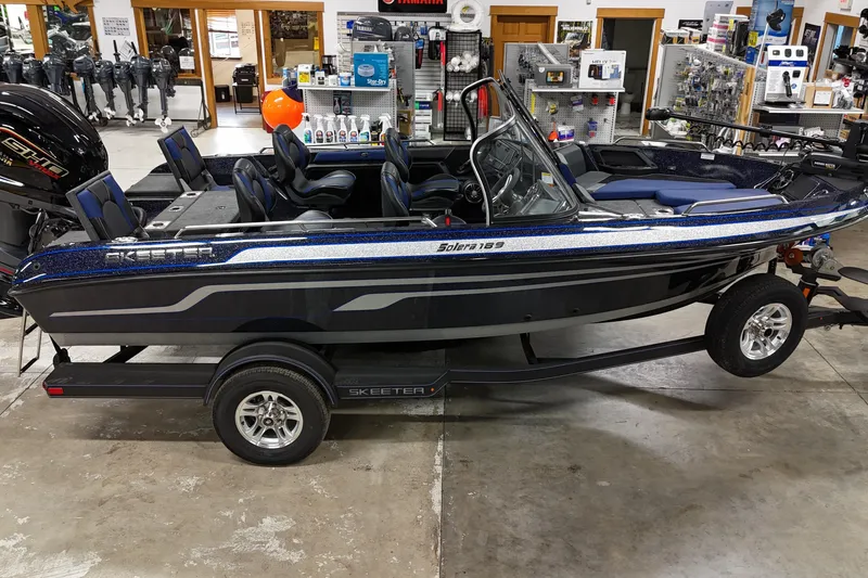 The Image of 2025 Skeeter Solera 189 boat displayed in a showroom, featuring sleek design and modern features. - 0