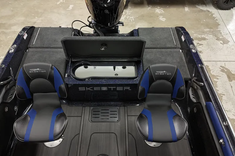 Slide: The Image of 2025 Skeeter Solera 189 boat interior with two seats and storage compartment. - 11