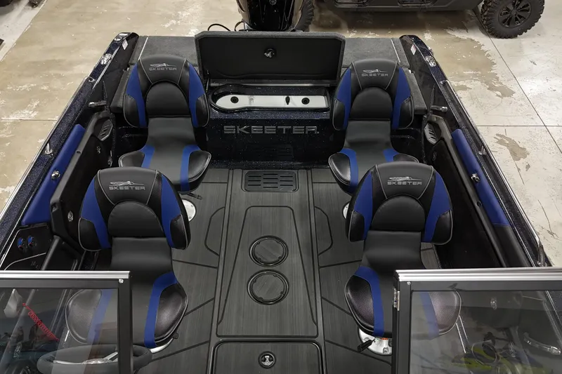 Slide: The Image of 2025 Skeeter Solera 189 boat interior with four black and blue seats. - 12
