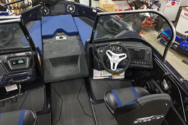 Slide: The Image of 2025 Skeeter Solera 189 boat interior with steering wheel and dashboard controls. - 16
