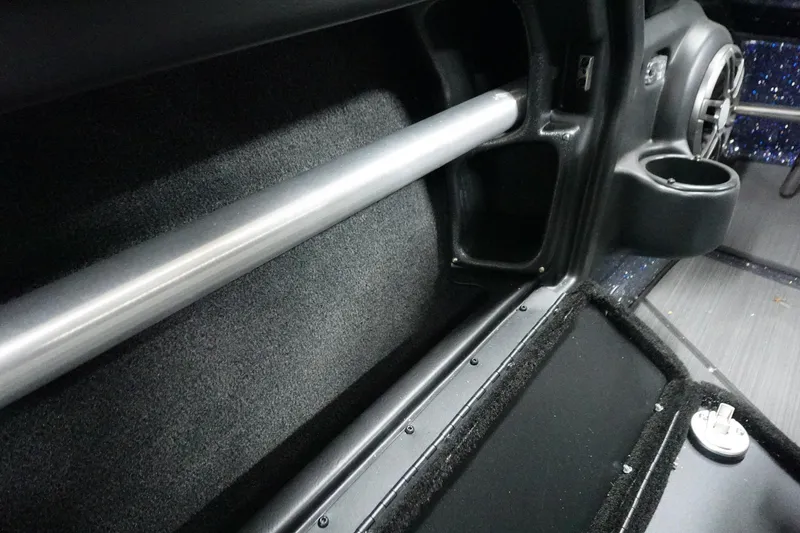 Slide: The Image of 2025 Skeeter Solera 189 interior detail with rod holder and cup holder. - 18