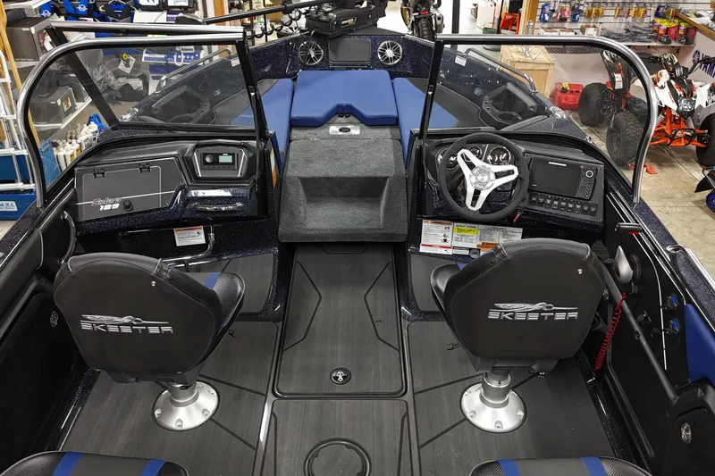 Slide: The Image of 2025 Skeeter Solera 189 boat interior with dual seats and modern dashboard. - 2