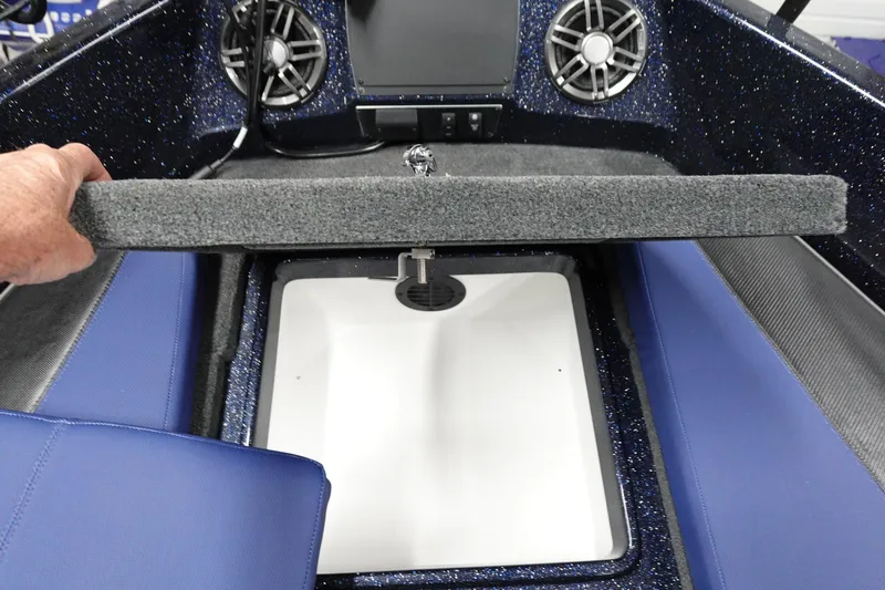 Slide: The Image of 2025 Skeeter Solera 189 boat interior with storage compartment and speaker system. - 21
