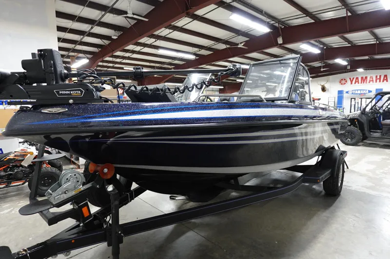 Slide: The Image of 2025 Skeeter Solera 189 boat in showroom, featuring Minn Kota trolling motor. - 25