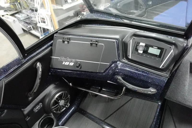 Slide: The Image of 2025 Skeeter Solera 189 boat dashboard with control panel and audio system. - 30