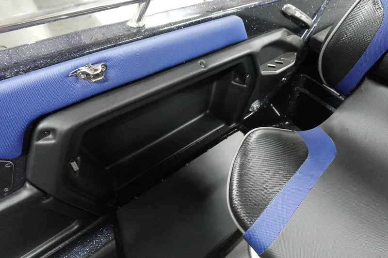 Slide: The Image of Interior of 2025 Skeeter Solera 189 boat with blue and black seating. - 31