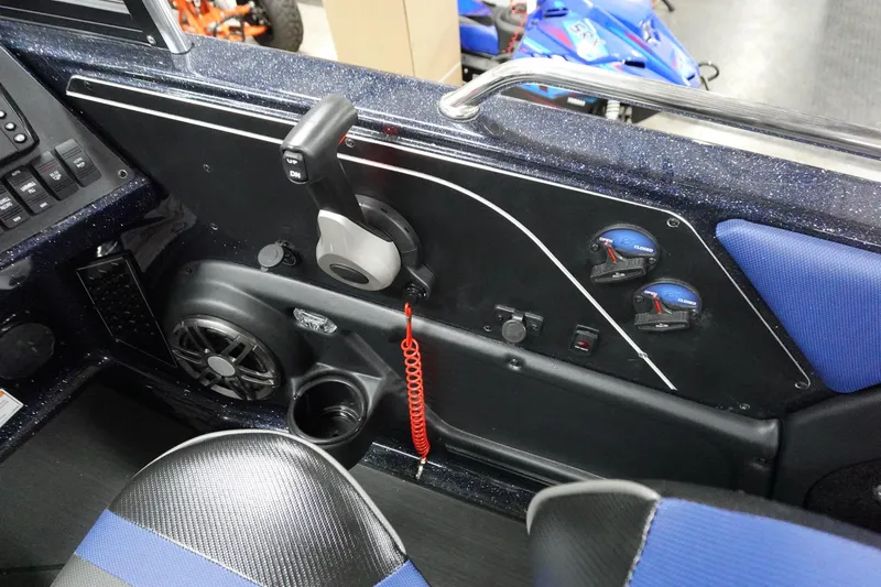 Slide: The Image of 2025 Skeeter Solera 189 boat interior dashboard with controls and blue accents. - 32