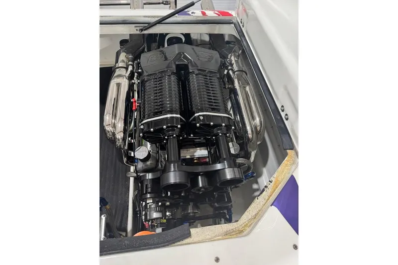 Slide: The Image of High-performance engine of a 1999 Skater 32B boat, showcasing intricate mechanical details. - 11