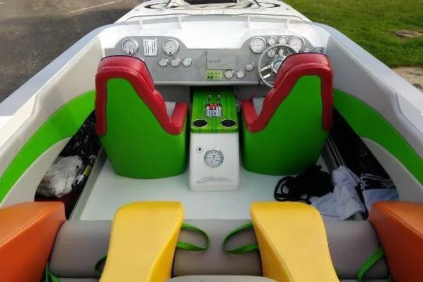 Slide: The Image of Colorful interior of a 1999 Skater 32B boat with vibrant seats and dashboard. - 17