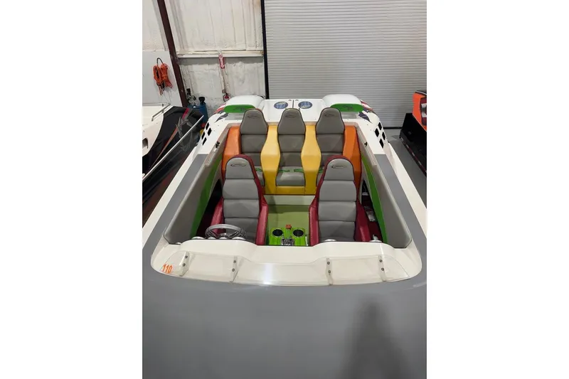 Slide: The Image of Colorful interior of a 1999 Skater 32B speedboat with six seats in a garage. - 6