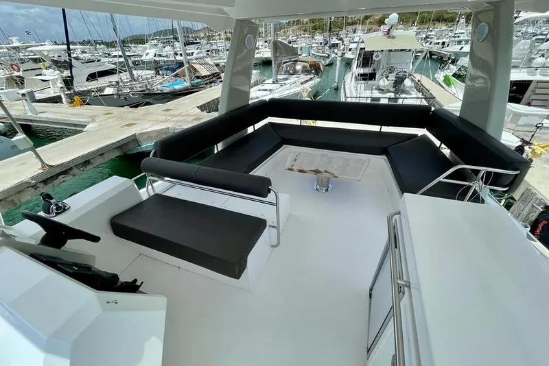 Slide: The Image of Luxurious 2019 Nautitech 47 Power yacht interior with spacious seating at marina. - 13