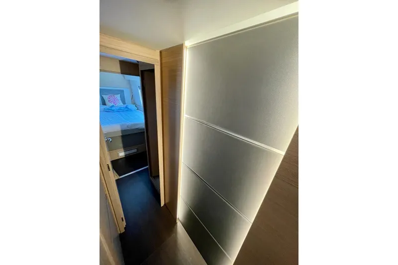 Slide: The Image of Interior of 2019 Nautitech 47 Power yacht, featuring a cozy bedroom and modern design. - 4